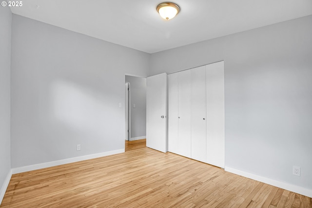 6255 SW Mad Hatter Ln, Beaverton, OR 97008 - unfurnished bedroom with wood finished floors and a closet