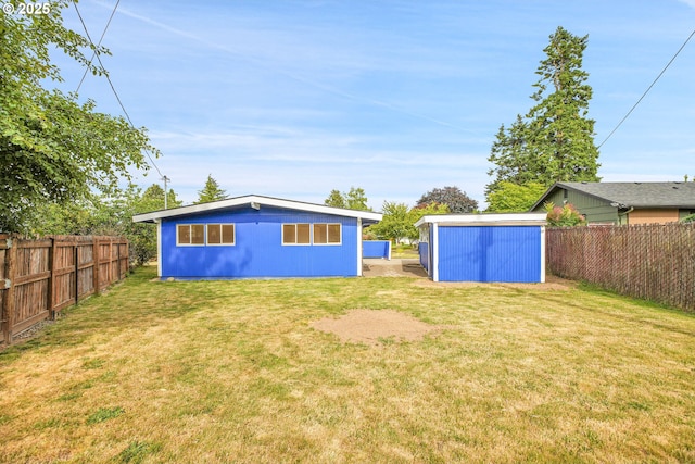 6255 SW Mad Hatter Ln, Beaverton, OR 97008 - rear view of house with a fenced backyard and a storage unit