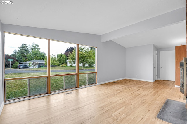 6255 SW Mad Hatter Ln, Beaverton, OR 97008 - unfurnished living room with baseboards and light wood-style floors