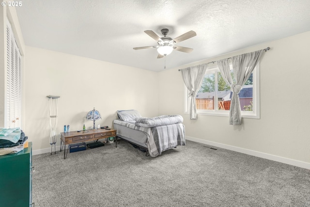 carpeted bedroom with a ceiling fan, baseboards, and visible vents