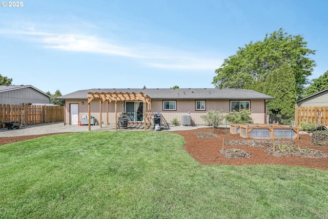 rear view of property with a lawn, a patio, central AC, and a pergola