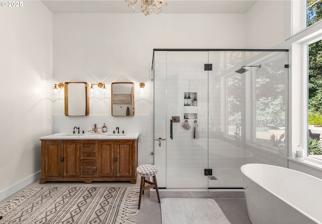 bathroom with vanity, independent shower and bath, and tile patterned flooring