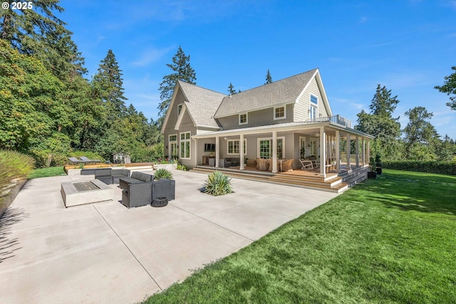 rear view of property with an outdoor hangout area, a lawn, and a patio area