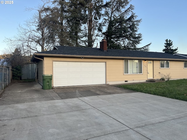 view of front of home with a garage, a chimney, fence, and concrete driveway