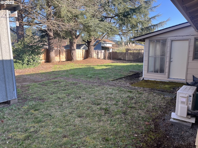 view of yard with fence private yard and ac unit