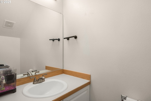 bathroom featuring visible vents and vanity