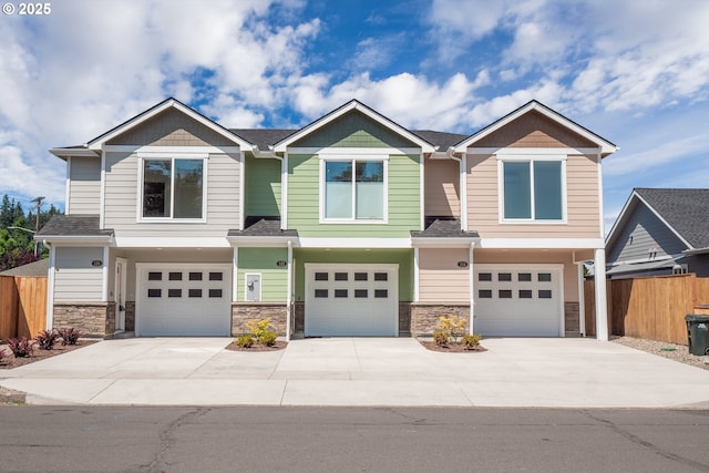 124 65th Pl, Springfield, OR 97478 - craftsman house featuring a garage, driveway, and stone siding