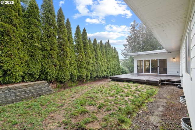 view of yard featuring a wooden deck