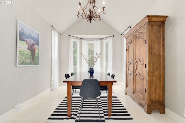 home office featuring lofted ceiling, light tile patterned floors, and an inviting chandelier