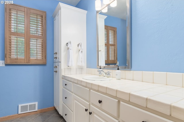 bathroom featuring vanity and tile patterned floors