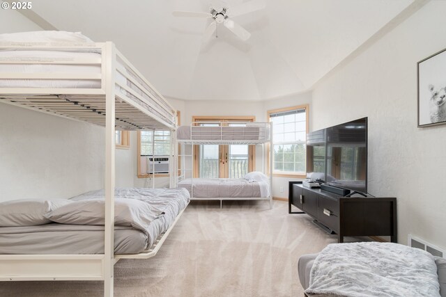 carpeted bedroom with lofted ceiling and cooling unit