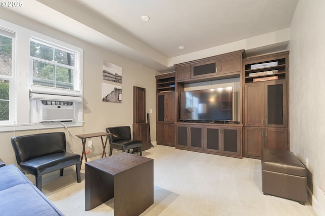 living room with light carpet and cooling unit