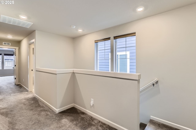 hallway featuring carpet flooring