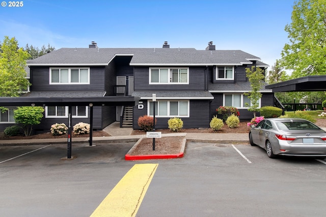 9455 SW 146th Ter Unit D 2, Beaverton, OR 97007 - view of front of home featuring covered and uncovered parking and a shingled roof