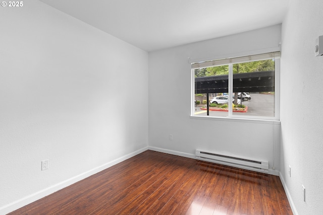 9455 SW 146th Ter Unit D 2, Beaverton, OR 97007 - unfurnished room with a baseboard radiator, hardwood / wood-style floors, and baseboards