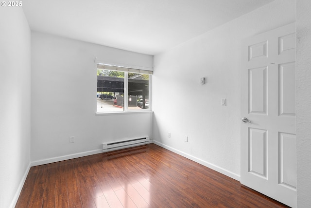 9455 SW 146th Ter Unit D 2, Beaverton, OR 97007 - unfurnished room with baseboard heating, wood finished floors, and baseboards