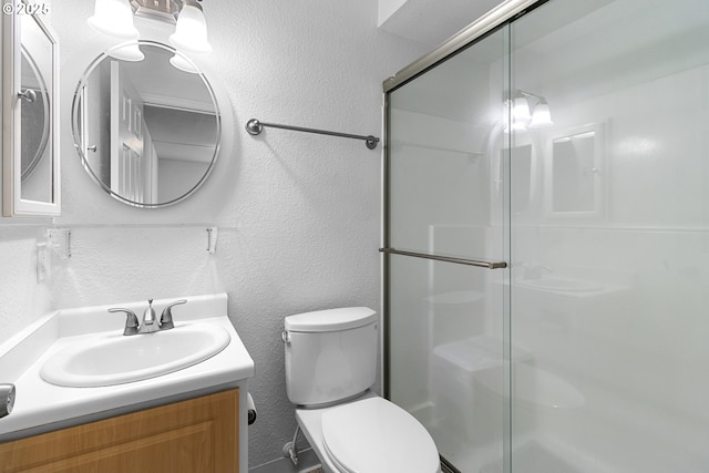 9455 SW 146th Ter Unit D 2, Beaverton, OR 97007 - full bath featuring a shower stall, toilet, vanity, and a textured wall
