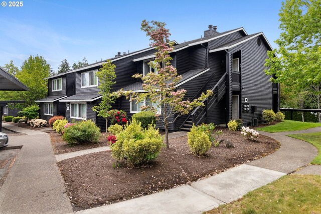9455 SW 146th Ter Unit D 2, Beaverton, OR 97007 - view of front facade featuring a chimney and stairway