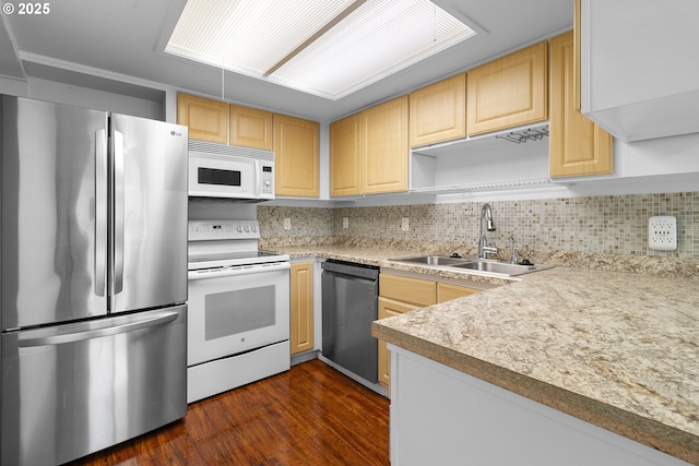 9455 SW 146th Ter Unit D 2, Beaverton, OR 97007 - kitchen featuring appliances with stainless steel finishes, a sink, light brown cabinetry, and tasteful backsplash