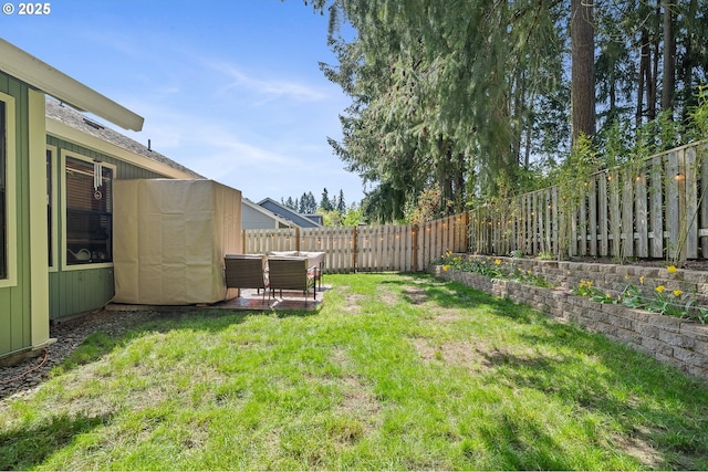 view of yard with a fenced backyard