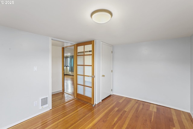 empty room featuring hardwood / wood-style floors