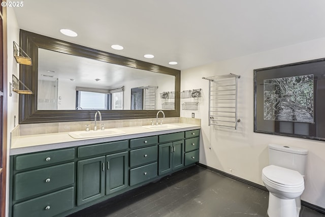 bathroom featuring vanity and toilet