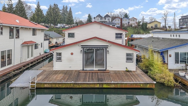 back of house with a water view