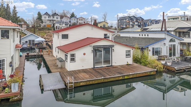 rear view of property featuring a water view