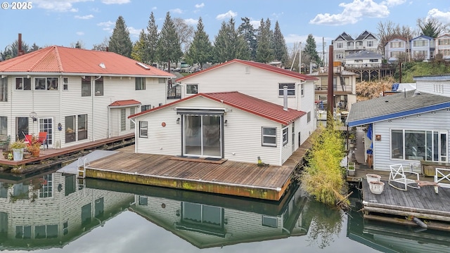 back of house with a water view