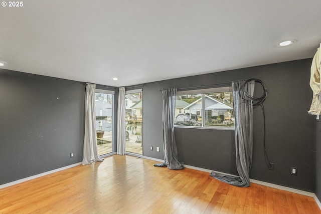 spare room featuring hardwood / wood-style flooring