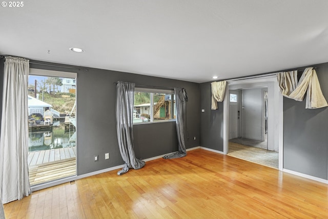 unfurnished room with wood-type flooring