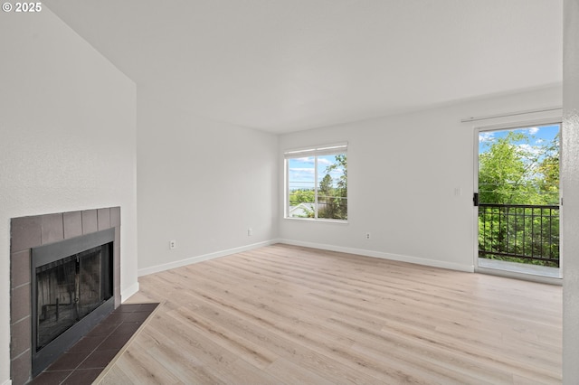 20910 Fawn Ct Unit 8, West Linn, OR 97068 - unfurnished living room featuring wood finished floors and a fireplace