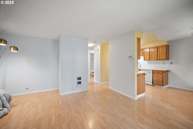 621 SE 121st Ave Unit 29, Vancouver, WA 98683 - unfurnished living room with a textured ceiling, light wood-style flooring, and heating unit