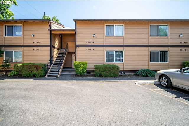 621 SE 121st Ave Unit 29, Vancouver, WA 98683 - view of property with uncovered parking and stairway