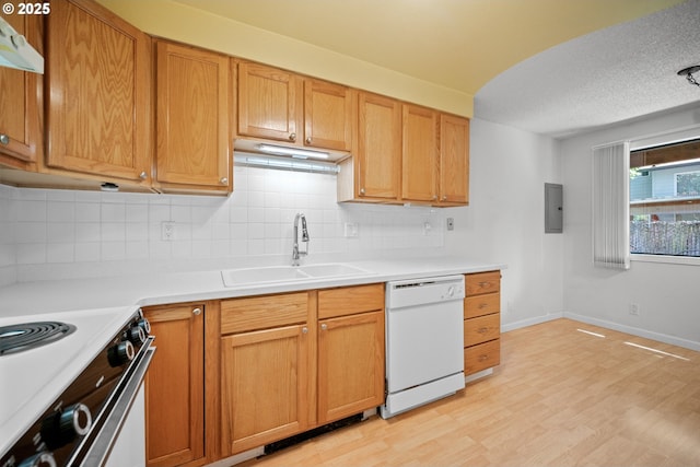 621 SE 121st Ave Unit 29, Vancouver, WA 98683 - kitchen featuring white appliances, backsplash, light countertops, light wood-style floors, and a textured ceiling