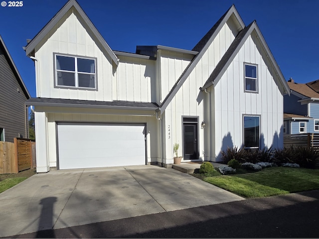 modern farmhouse style home with board and batten siding, fence, concrete driveway, and a garage