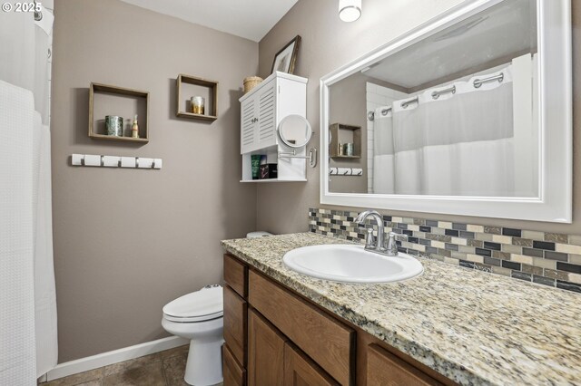 kitchen with appliances with stainless steel finishes, a sink, dark wood-style floors, and brown cabinets