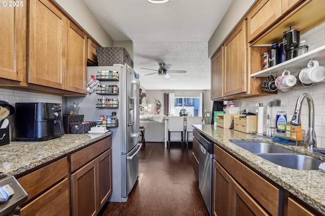 kitchen featuring sink, a textured ceiling, dark hardwood / wood-style floors, ceiling fan, and decorative backsplash