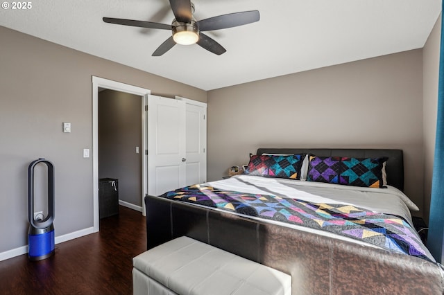 bedroom with ceiling fan, dark hardwood / wood-style floors, and a closet