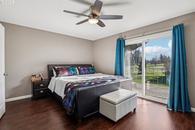 bedroom featuring dark wood-type flooring, access to outside, and ceiling fan