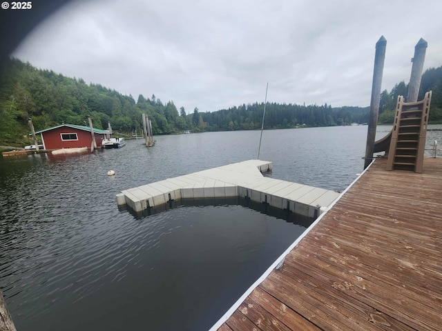 747 N Tenmile, Lakeside, OR 97449 - dock featuring a water view and a wooded view