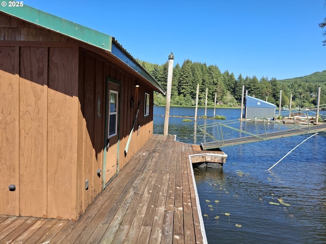 747 N Tenmile, Lakeside, OR 97449 - dock area featuring a view of trees and a water view