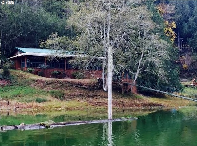 747 N Tenmile, Lakeside, OR 97449 - dock area featuring a water view and a view of trees