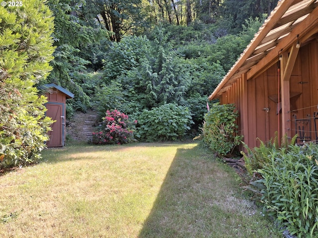 747 N Tenmile, Lakeside, OR 97449 - view of green lawn with a storage shed