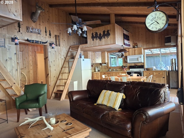 747 N Tenmile, Lakeside, OR 97449 - living room with stairway, wooden walls, light carpet, beam ceiling, and a ceiling fan