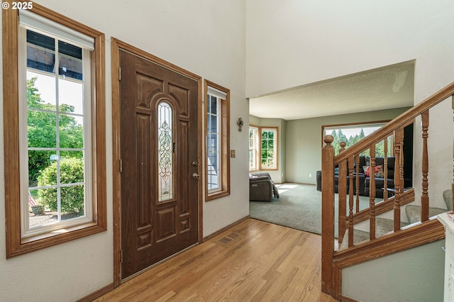 30174 SE Waybill Rd, Boring, OR 97009 - entryway with stairs, light wood-style flooring, and baseboards