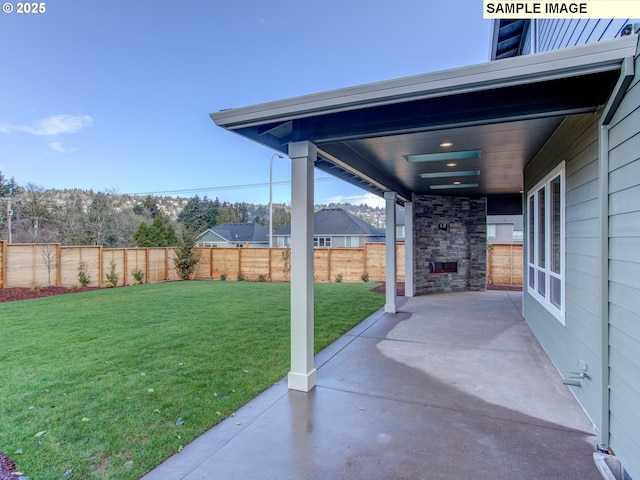 10216 NW Lee St, Portland, OR 97229 - view of yard featuring an outdoor stone fireplace and a patio