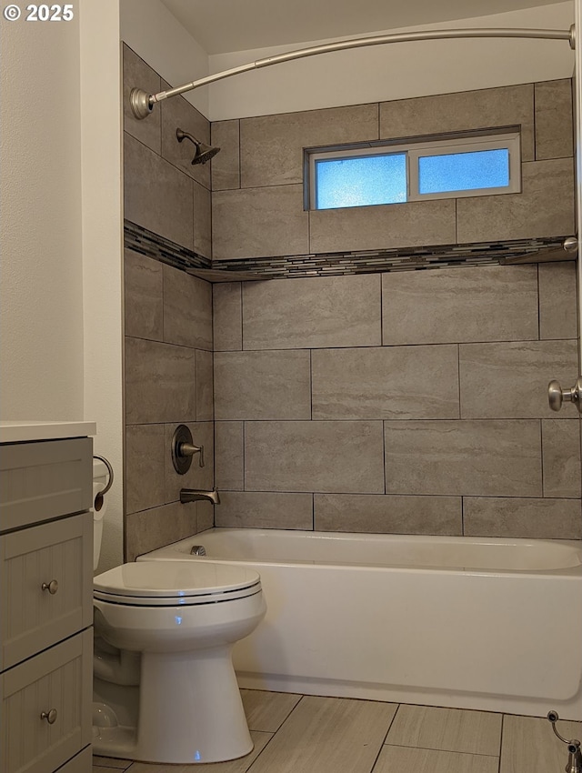 bathroom with vanity and tiled shower / bath combo