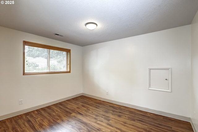 14075 SW Cherryhill Dr, Beaverton, OR 97008 - unfurnished room featuring baseboards, dark wood-type flooring, and visible vents