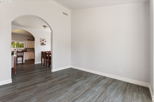 227 Hauser Ct, Molalla, OR 97038 - spare room with dark wood-style flooring and baseboards